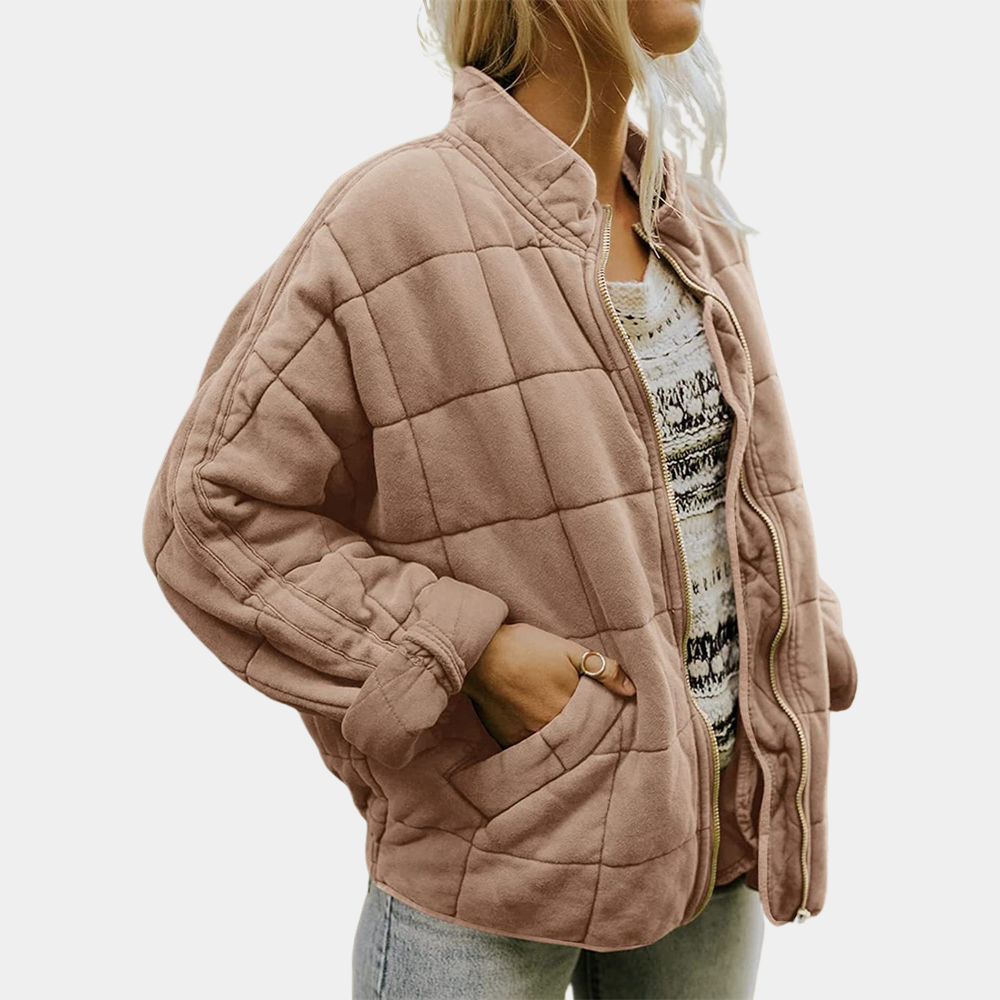 Light brown quilted puffer jacket with zip front and padded long sleeves