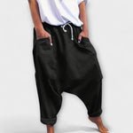 Wide-leg harem pants with drawstring waist, black, side pockets.