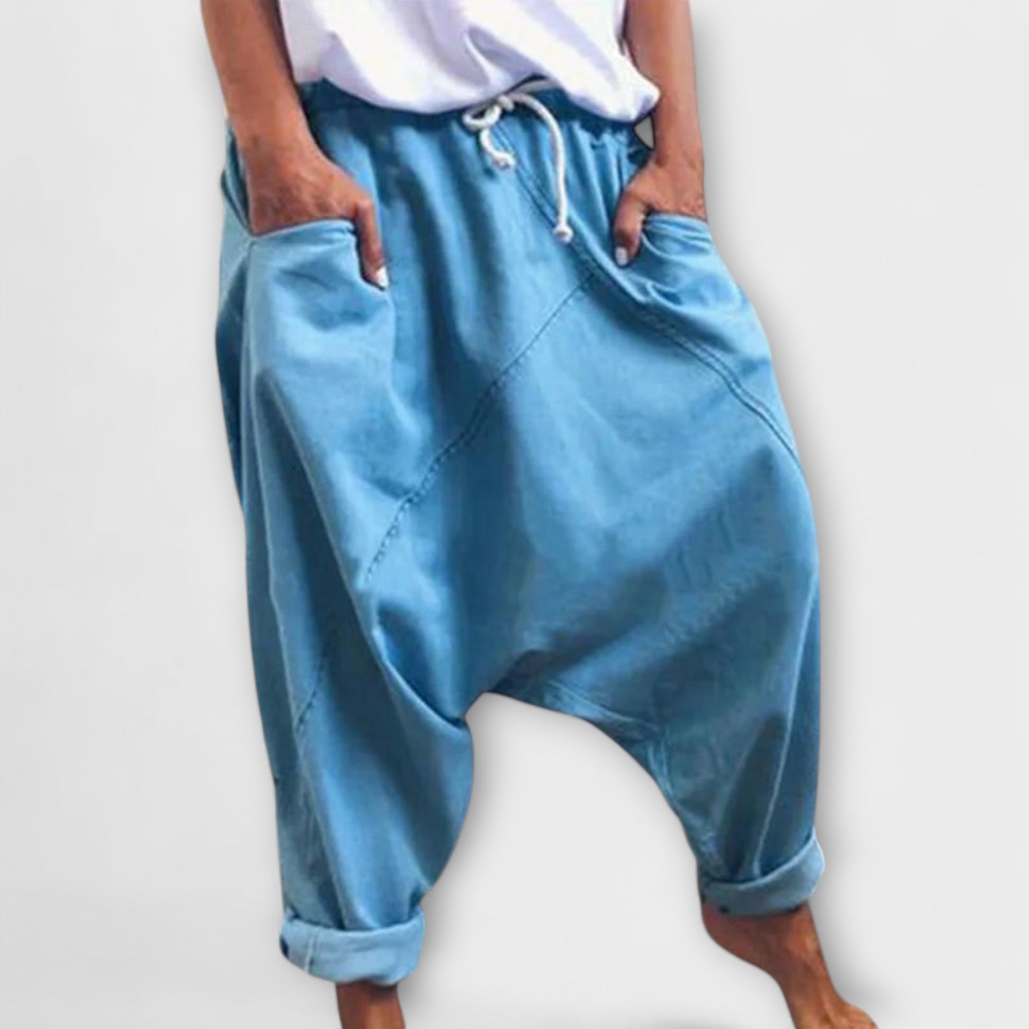 Wide-leg harem pants with drawstring waist, light blue, side pockets.