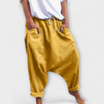 Wide-leg harem pants with drawstring waist, mustard yellow, side pockets.