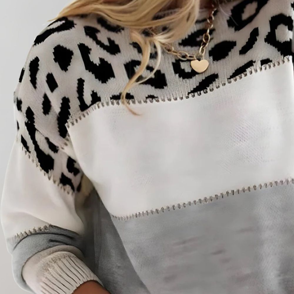 Leopard-print knit sweater with contrast yoke and round neck; close-up of texture