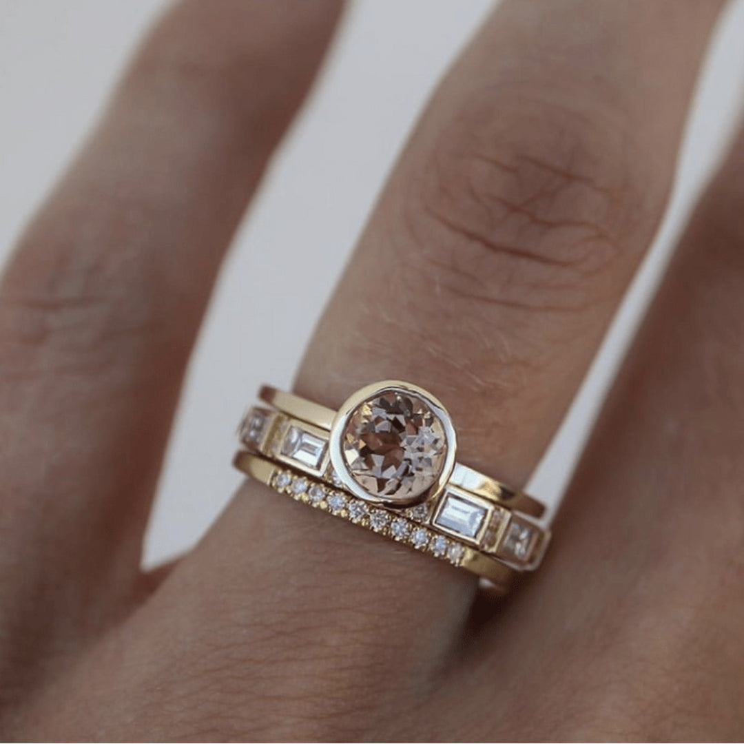 Vintage gold-tone ring with round clear center stone and baguette side stones