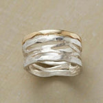 Two-tone vintage ring in gold and silver with wavy ridged band, polished metal