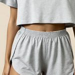 Gray striped crop top and ruched elastic-waist shorts, high-waist look