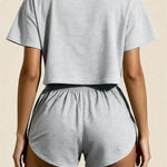 Gray striped crop top with crew neck and matching elastic-waist shorts, back view