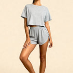 Gray striped two-piece set with short-sleeve crop top and elastic-waist shorts, full body
