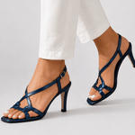 Navy blue open-toe heeled sandal with thin straps and charm detail