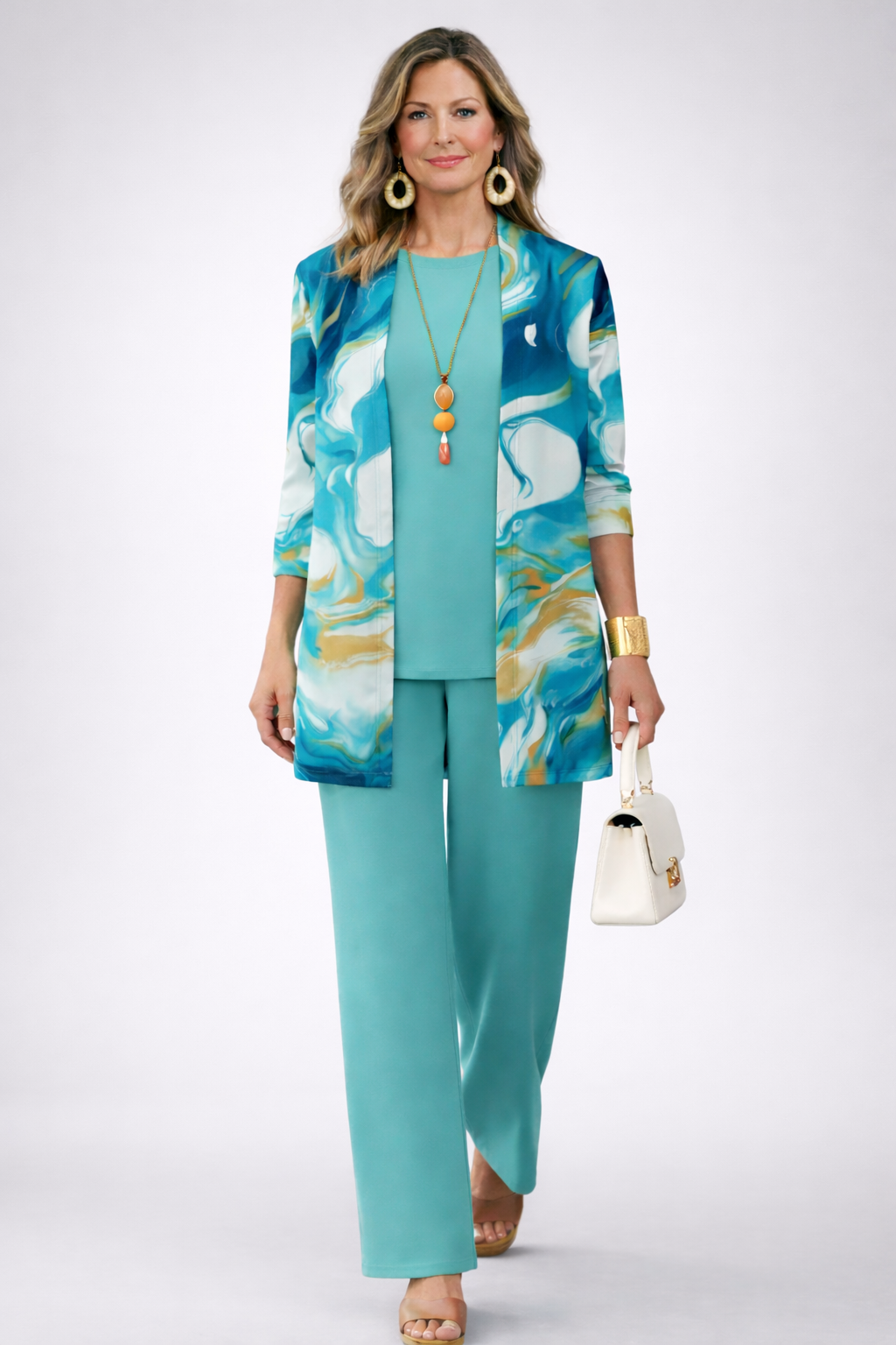 Three-piece teal set with printed longline jacket, tank top, and wide-leg pants