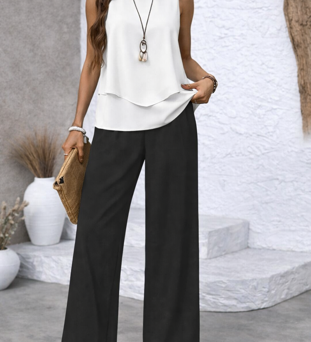 Monochrome elegance set: white sleeveless layered top, black wide-leg trousers