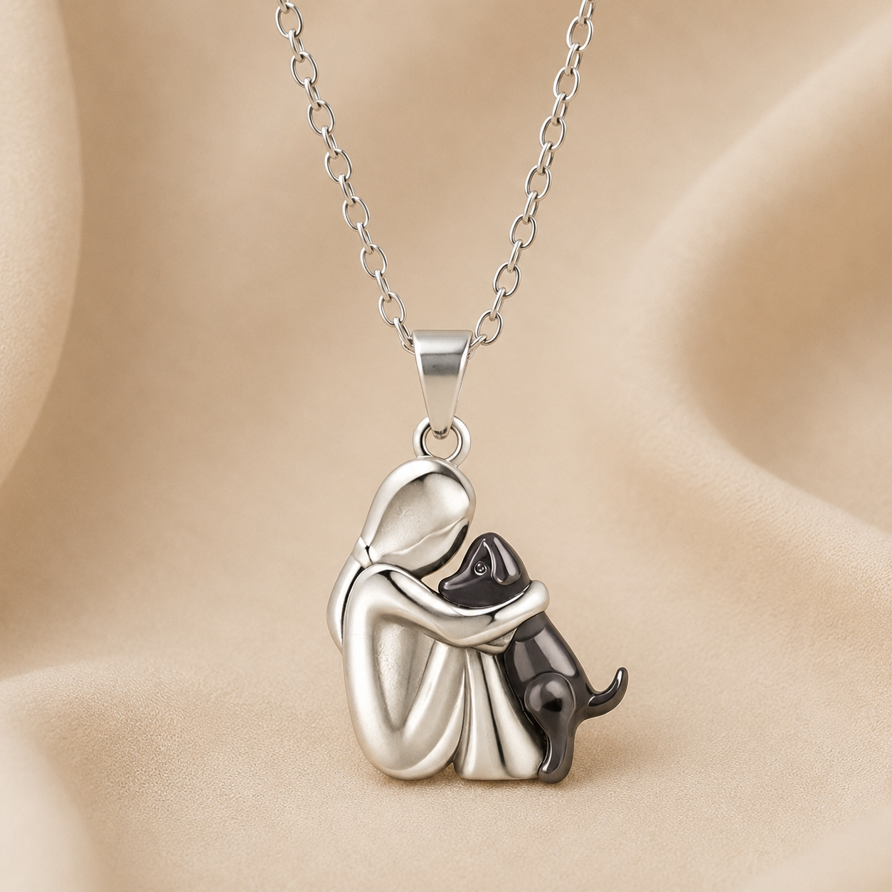 Hugging cat pendant necklace, silver-tone charm with black-tone cat accents and chain