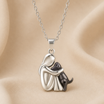 Hugging cat pendant necklace, silver-tone charm with black-tone cat accents and chain