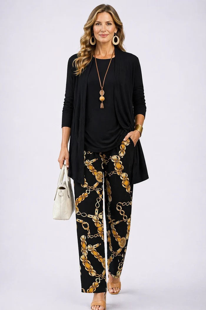 3-piece outfit set in black: long open jacket, top, and gold chain print pants