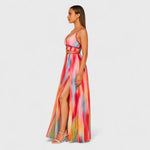 Sleeveless long printed maxi dress with multicolor abstract print; high front slit, side view.