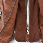Camel-brown biker-style jacket with silver zip front and stitched panel seams