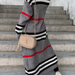 Long gray cardigan with black-and-white horizontal stripes and red stripe border.