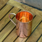 Copper 470 ml mug with engraved mandala, reflective interior, and side handle.