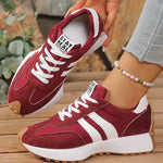 Burgundy and white sport sneakers with suede panels, lace-up front, cushioned sole