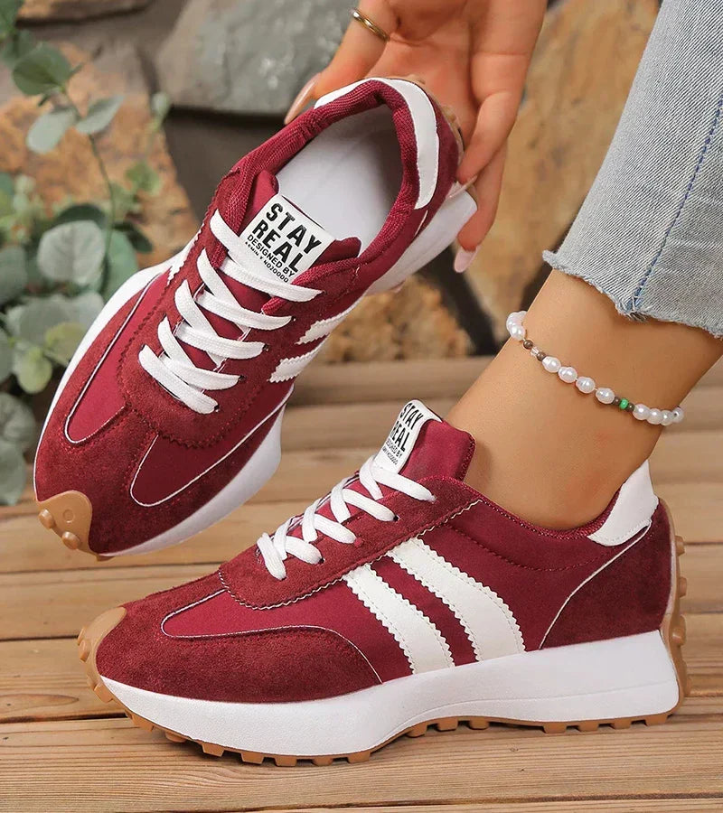 Burgundy and white sport sneakers with suede panels, lace-up front, cushioned sole
