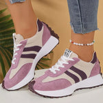 Lilac and white sport sneakers with striped side panels, lace-up design, rubber sole