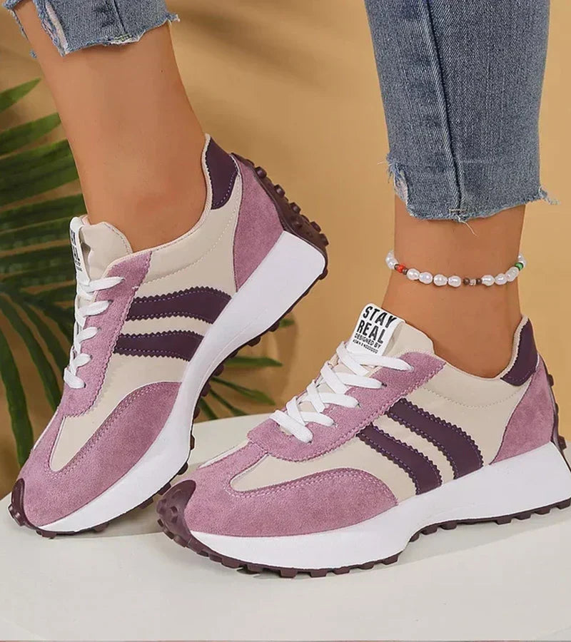 Lilac and white sport sneakers with striped side panels, lace-up design, rubber sole