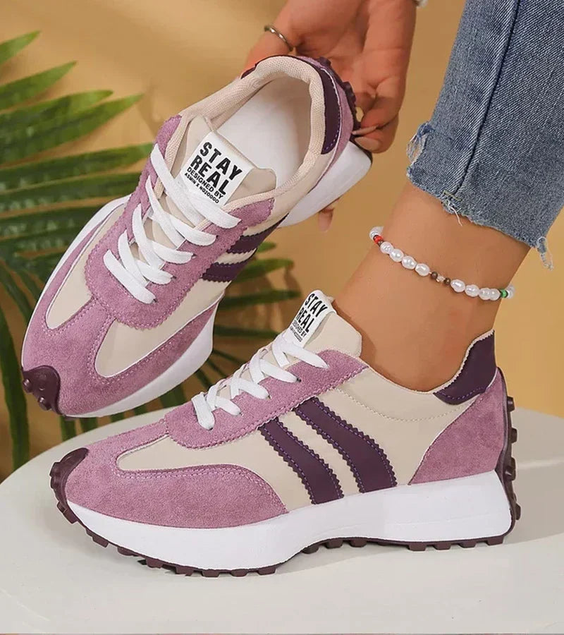 Lavender suede-look lace-up sneakers with white stripes and stay real tag, chunky sole