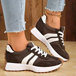Brown and white lace-up sport sneakers with white stripe detail and low-profile sole