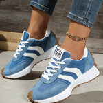 Blue suede-look lace-up sneakers with white adidas-style stripes and rugged sole