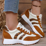 Brown and tan leopard-print lace-up sneakers with white accents and chunky sole