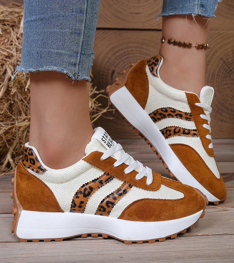 Brown and tan leopard-print lace-up sneakers with white accents and chunky sole