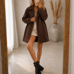 Brown comfort coat, double-breasted buttons and notched lapels, above-knee length
