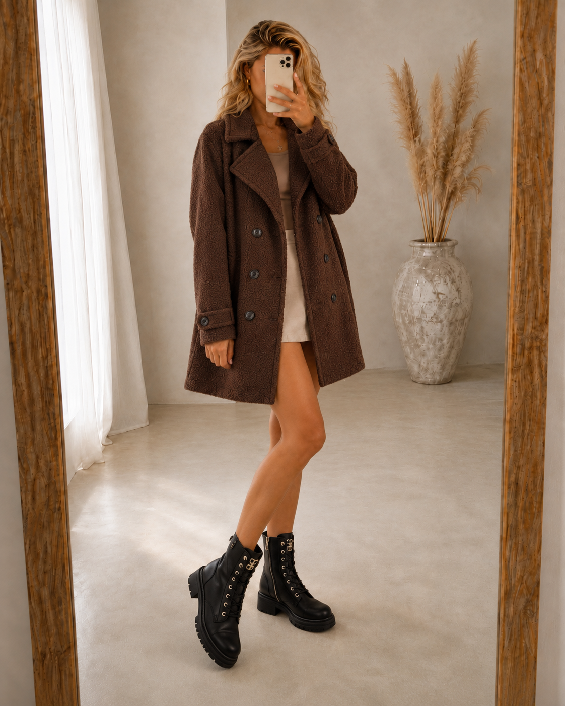 Brown comfort coat with notched lapels, double-breasted button closure, long sleeves
