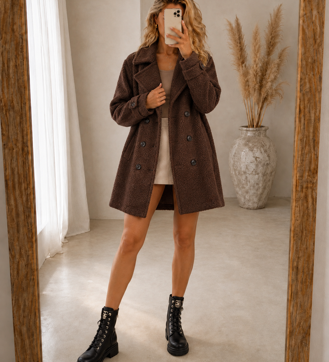 Brown comfort coat with double-breasted button front, notched lapels, above-knee length