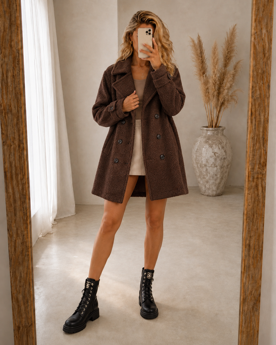 Brown comfort coat with double-breasted button front, notched lapels, above-knee length
