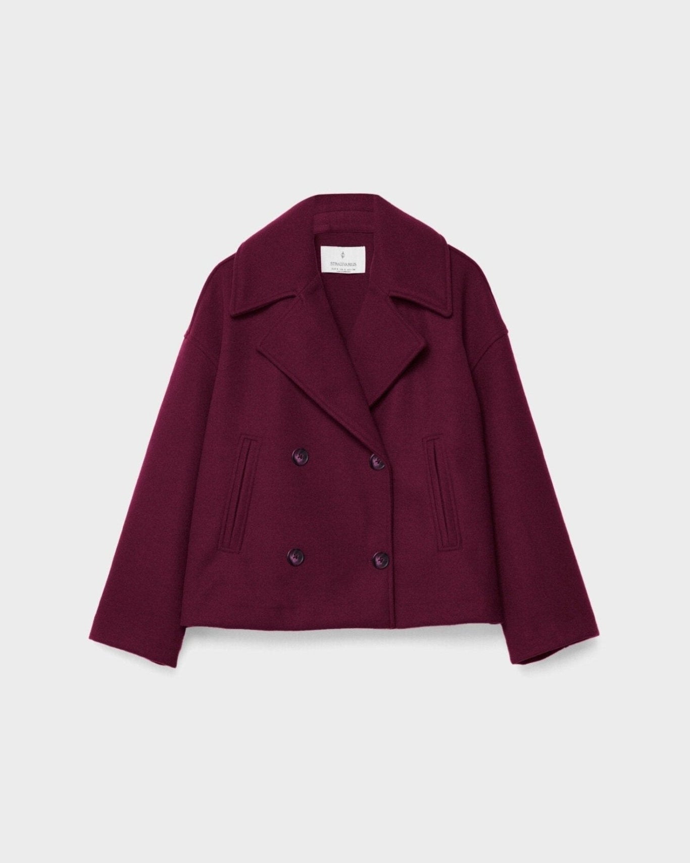 Burgundy double-breasted coat with wide lapels and button front.