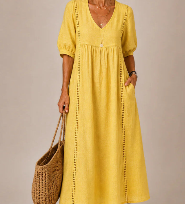 Yellow midi dress with V-neck, short puff sleeves, gathered waist, and vertical stitched trim
