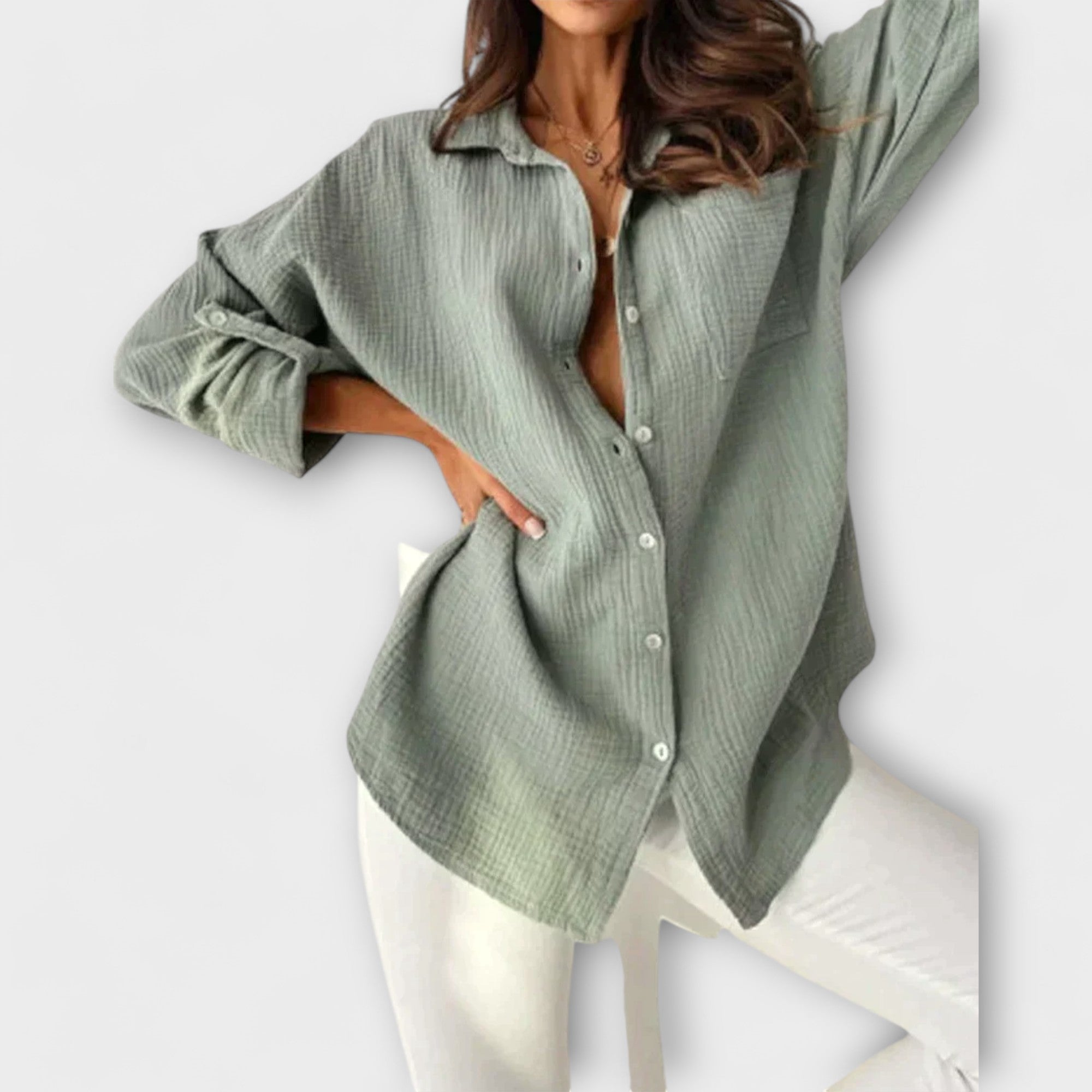 Sage green women’s button-front blouse with long sleeves and collar.