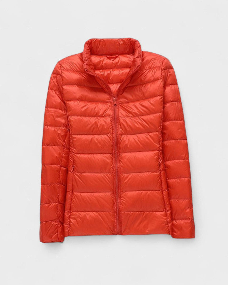 Red-orange quilted puffer jacket with zip-front and stand collar