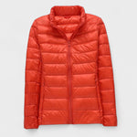 Red-orange quilted puffer jacket with zip-front and stand collar