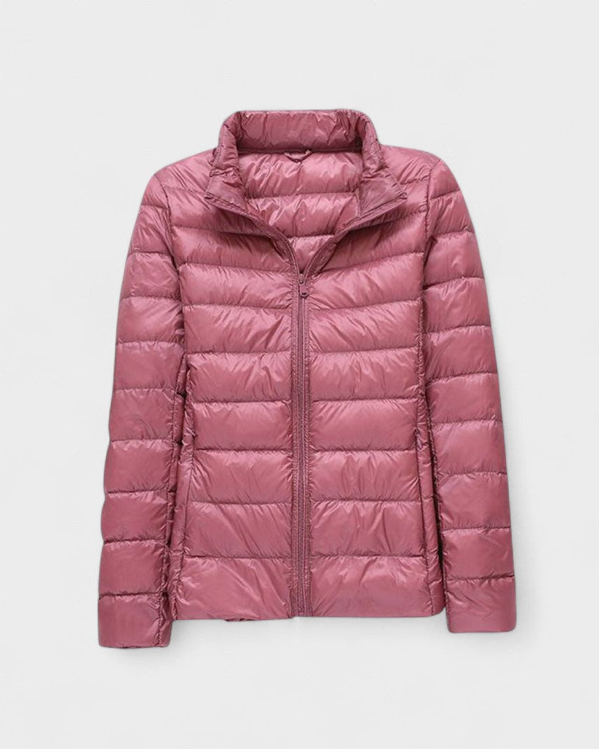 Mauve/pink puffer jacket with full front zipper and high stand collar.