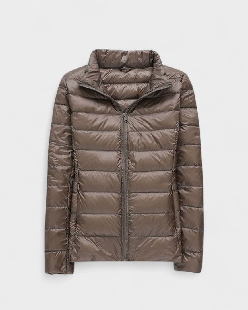 Taupe/brown puffer jacket with full front zipper and high stand collar.