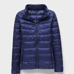 Navy blue puffer jacket with full front zipper and high stand collar, quilted panels.