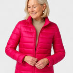 Bright pink puffer jacket with full zipper, stand collar, and quilted puffy panels.