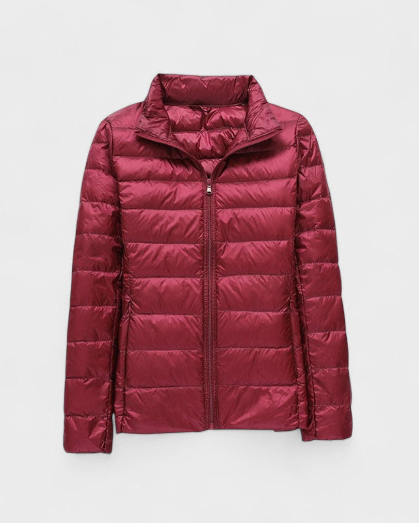 Burgundy red puffer jacket with full front zipper and high stand collar.