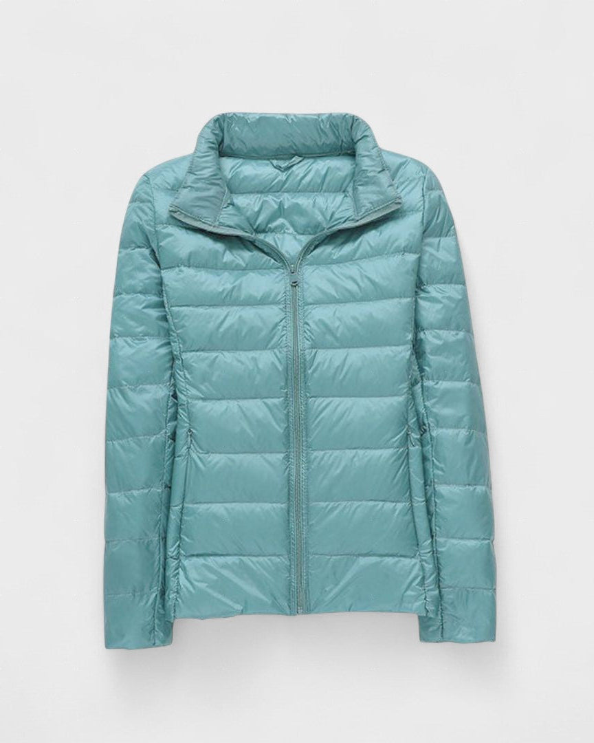 Light teal puffer jacket with full front zipper and high stand collar, long sleeves.