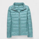 Light teal puffer jacket with full front zipper and high stand collar, long sleeves.