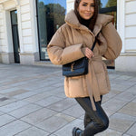 Beige oversized puffer jacket with hood and tie belt, front snaps