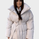 Pale beige oversized puffer jacket with hood and tie belt, snap buttons