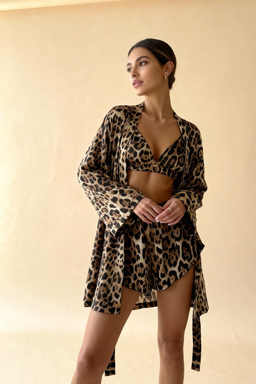 Leopard-print pajama kimono robe over V-neck bra top and elastic shorts