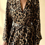 Leopard-print robe with waist tie over pajama bra top and elastic shorts