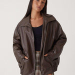 Florence brown leather jacket on model, front zip closure and stand collar